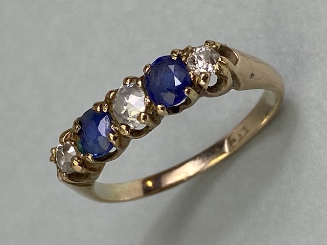 9ct yellow gold five stone ring set with two Sapphires and three diamonds in a liner setting