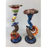 Ross Emerson Art ceramics, being Two twisty candle sticks in multi colour ways approximately 24