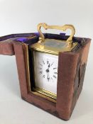 Vintage carriage clock of brass with clear panels, white dial with roman numerals approximately 11cm