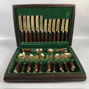 Vintage Cutlery, a 44 piece canteen of mid century bronze and teak cutlery in its fitted case (