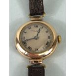9ct Gold Ladies early 20th century round wrist watch on leather strap approximately 14.86g
