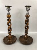 Wooden twisted stem / open barley twist candle sticks with silver coloured metal mounts each