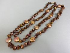 Pearls, a string of bronze dyed baroque pearls with 14kt clasp approximately 36in