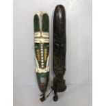 Decorative tribal interest, two large carved wall masks, African figure and an Egyptian fertility