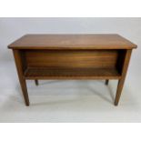 Mahogany library table with open bookshelves to either long side, with tapering fluted legs,