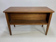 Mahogany library table with open bookshelves to either long side, with tapering fluted legs,
