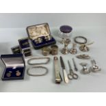 Quantity of silver items to include cigar cutter, napkin rings, bracelet's etc