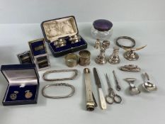 Quantity of silver items to include cigar cutter, napkin rings, bracelet's etc