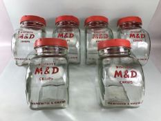 Advertising interest, early 20th century Meredith & Drew glass shop storage jars with red