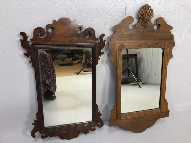 Antique Mirrors, two early 19th century wooden framed mirrors of scroll design one with a carved