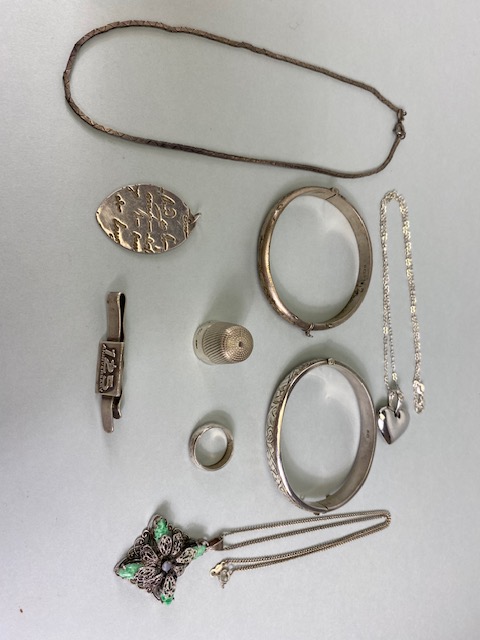 Silver hall marked jewellery and other items to include two bangles, money clip ring heart crystal