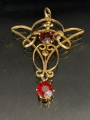 Antique jewellery, Art Nouveau unmarked rose gold metal pendant set with two garnets,