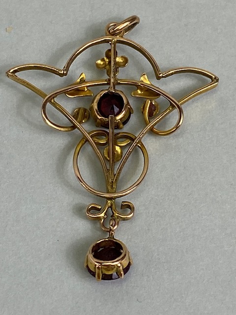 Antique jewellery, Art Nouveau unmarked rose gold metal pendant set with two garnets, - Image 5 of 5