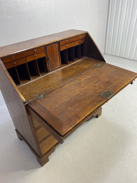 Oak Bureau with four drawers, fall front revealing pigeon holes and ornate key to lock approx 97 x - Image 13 of 14