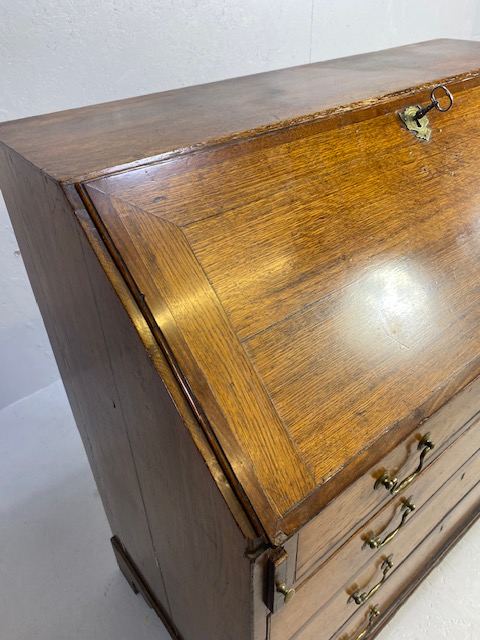 Oak Bureau with four drawers, fall front revealing pigeon holes and ornate key to lock approx 97 x - Image 3 of 14