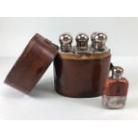 Sporing interest, early 20th century leather cased set of spirit flasks and a small tot flask