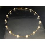 9ct gold wire and cultured pearl choker necklace of single strand design set with 15 pearls