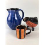 Ross Emerson Art Ceramics, Blue striped jug approximately 16cm high, Tripod sauce boat in orange,