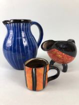 Ross Emerson Art Ceramics, Blue striped jug approximately 16cm high, Tripod sauce boat in orange,