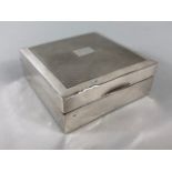 Silver English hall marked square wooden lined cigarette box of simple design approximately 8.5 x