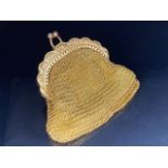 Gold Chain mail coin purse tests as 9ct or above in outstanding condition lined in orange satin
