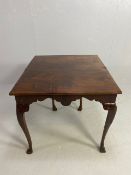 Victorian side table with folding leaf extending to make a tea table in flame mahogany with lion paw