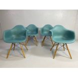 Vitra Eames plastic armchairs, design Charles and Ray Eames, set of four with outsplayed wooden