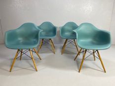 Vitra Eames plastic armchairs, design Charles and Ray Eames, set of four with outsplayed wooden