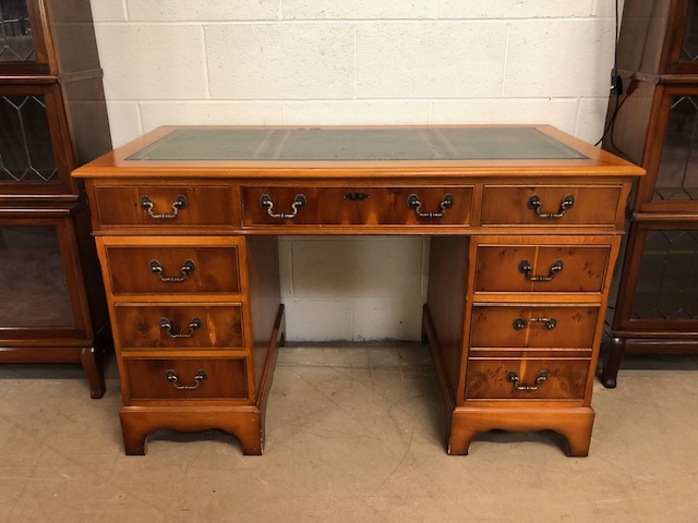 Modern knee hole desk of six drawers with three drawer top and leather inlay approximately 120 x