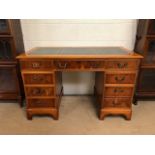 Modern knee hole desk of six drawers with three drawer top and leather inlay approximately 120 x