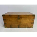 Large Campaign travelling trunk with brass bindings and corners and hinged carry handles to sides