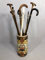 Collection of vintage walking sticks , animal head tops, horn,stone set, white metal, in a