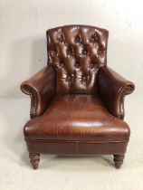 Burgundy leather button back fireside chair with stud detailing and turned front legs