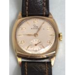 9ct Gold watch by RECORD square face with subsidiary dial at 6pm winds runs and sets on leather