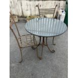 Marble topped Bistro table on wrought Iron curved legs with two wrought iron chairs