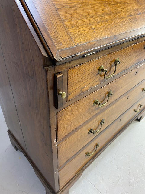 Oak Bureau with four drawers, fall front revealing pigeon holes and ornate key to lock approx 97 x - Image 4 of 14