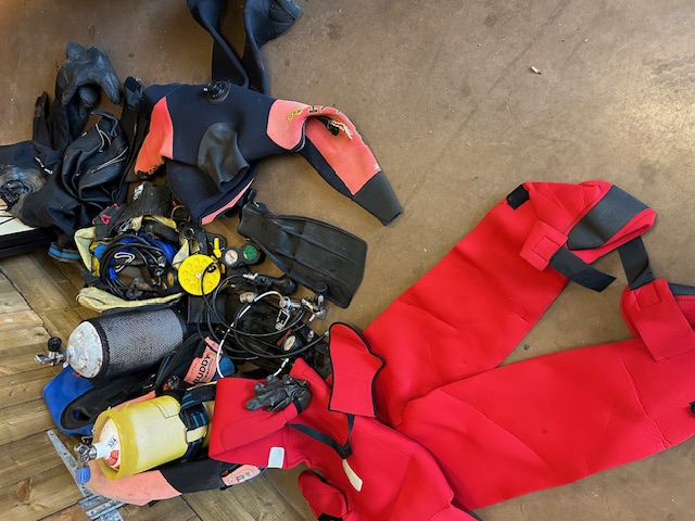 Collection of Suba diving equipment to include SCUBA tanks/ cylinders, Dry Suits, Regulators, weight