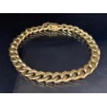 9ct yellow gold rolled curb chain bracelet approximately 24cm in length and 20.7g