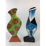 Ross Emerson Art Ceramics, Two flat bodied vases, one with a surrealist table scene in blue tones