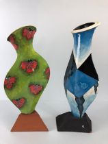 Ross Emerson Art Ceramics, Two flat bodied vases, one with a surrealist table scene in blue tones