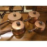 Vintage Retro mid century set of Copper pans with teak handles, comprising three sauce pans and