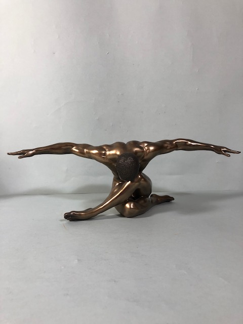 Statue of a Male dancer in a knelt position with arms spread, bronze finish resin approximately 13 x