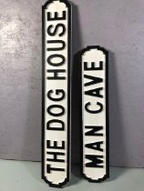 Two wooden signs, Man Cave, Dog House in the shape of street plaques