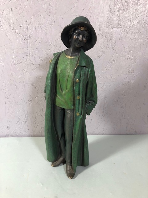 Figurine of a woman in a long coat approximately 39cm high