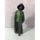 Figurine of a woman in a long coat approximately 39cm high