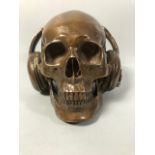 Brass Human Skull wearing headphones patinated finish approximately 14cm high