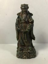 Chinese figure of an Immortal in carved green stone approximately 22cm high