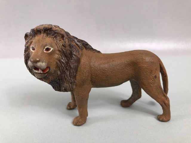 Bronze lion with cold painted finish approximately 8cm