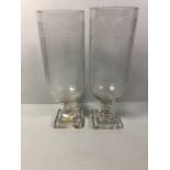 Pair of Colonial style glass hurricane vases each approximately 34cm high