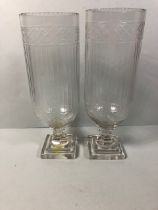 Pair of Colonial style glass hurricane vases each approximately 34cm high